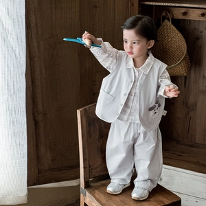 Three-piece boy spring suit with grey vest, plaid shirt and trousers for casual wear
