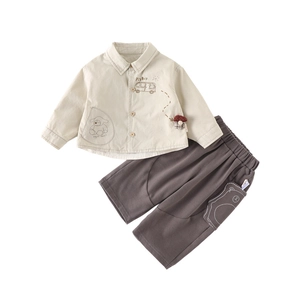 Two-piece baby boy spring outfit with cream shirt featuring cartoon bus and grey pants