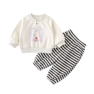 Infant two-piece outfit with duck print cream sweatshirt and striped cotton trousers