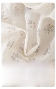 Close-up of soft floral cotton muslin fabric texture for baby girl summer outfit