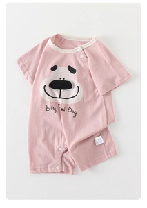 Macro view of pink cotton baby bodysuit with cute cartoon dog print and snap buttons
