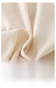 Detail of soft breathable cream knitted cotton fabric for baby short sleeve romper