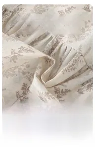 Detailed view of floral cotton fabric with elegant embroidered lace trim for girls