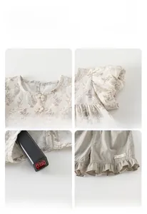 Detail view of floral cotton top and shorts set showing neckline and hem ruffles