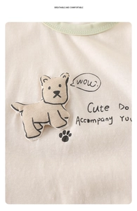 Close-up of baby bodysuit featuring 3D puppy patch and soft breathable cotton fabric