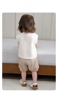 Detailed back view of toddler cotton white tank top and brown checkered bloomers set