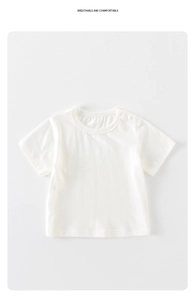 Detail of white waffle knit baby bodysuit featuring shoulder buttons and breathable cotton fabric