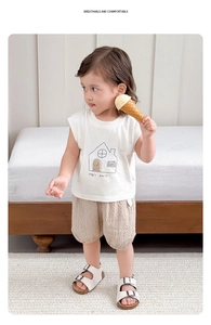 Detail of baby boys summer set with white sleeveless tee and plaid shorts