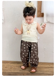 Close-up of baby girl lace collar top with bunny print and floral pants set