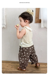 Detail view of toddler sleeveless top with lace collar and floral print pants set