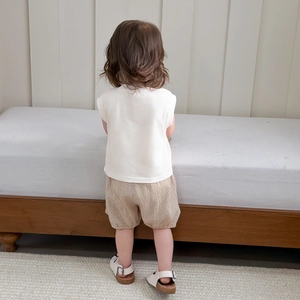 Baby boy summer set with sleeveless white cotton T-shirt and khaki plaid bloomers