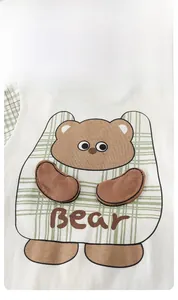 Detail of newborn cotton bodysuit with brown cartoon bear embroidery and green plaid trim