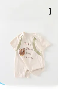 Close-up of baby romper with breathable cotton fabric and 3D cartoon bear embroidery