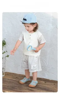Detailed view of kids summer cotton set with striped sleeves and cartoon pocket design