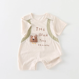 Short sleeve cream baby romper with bear patch and green shoulder accents for summer wear