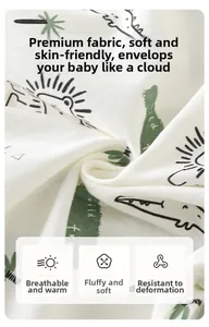 Detailed macro view of white cotton knit fabric with green cartoon dinosaur patterns