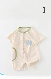 Detail of baby cotton romper featuring cartoon lion print and breathable mesh fabric