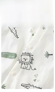 Close-up of baby romper with animal prints and secure white snap buttons for easy dressing