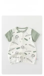 Detail of baby short sleeve romper with wild free lion print and snap buttons