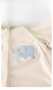 Detailed view of breathable cotton baby romper featuring a blue elephant print and snaps