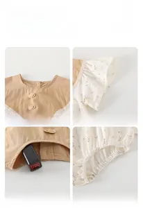 Detail of floral baby romper showing non-toxic safety test and lace collar