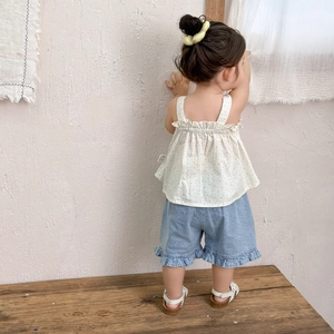 Toddler girl floral camisole set with denim shorts and ruffled hems in summer style
