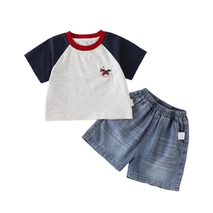 Kids summer outfit with red and blue raglan sleeve t-shirt and denim shorts set