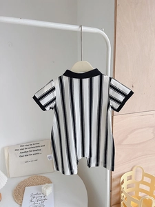 Detail shot of baby striped romper with black collar and snap buttons for summer