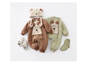 Flat lay of quilted baby winter rompers with bear embroidery, matching hat and shoes