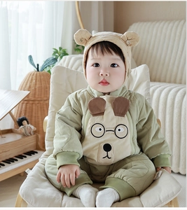 Close-up of baby winter padded romper with dog embroidery and 3D ear hood detail