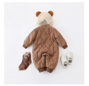 Detailed set of brown quilted baby romper with beige hat, bear socks, and soft shoes