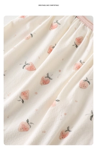 Close-up of strawberry print fabric on baby summer romper showing soft knit texture