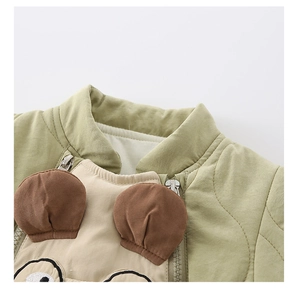 Close-up of baby quilted winter romper with cute animal ears and secure zip closure