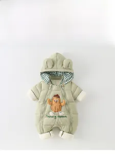 Detail of light green baby hooded romper with bear ears and cute peanut embroidery