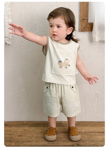 Detail view of toddler summer set featuring sleeveless vest with horse pocket and striped shorts
