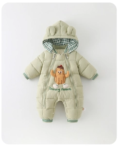 Detail of baby winter romper with dual zippers and cute peanut embroidery on light green fabric