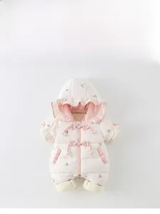 Detail of baby winter romper featuring floral embroidery and ruffle collar accents