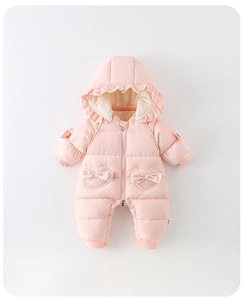 Detailed view of pink quilted baby winter romper with heart ruffles and warm lining