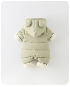 Close-up of padded baby snowsuit with cute bear ears and faux fur trim on a light green fabric