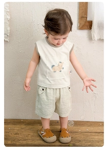 Detail of baby boy summer outfit with cotton pony print tank top and plaid shorts