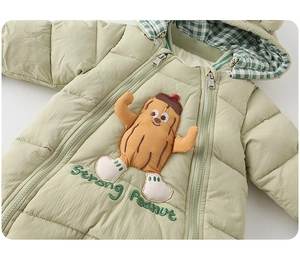 Detail of baby winter jumpsuit featuring Strong Peanut embroidery and dual zipper system