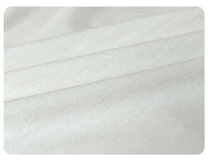 Close-up of white breathable cotton fabric texture for baby summer jumpsuit