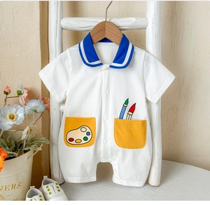Detail view of baby summer bodysuit featuring navy collar and cute yellow pockets