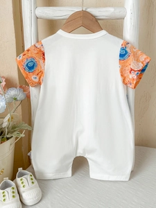 Short-sleeve baby romper in white cotton with artistic starry night style printed sleeves