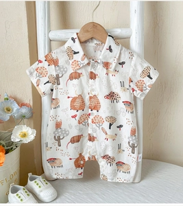 Close-up of cotton baby romper featuring cute cartoon animal prints and polo collar detail