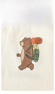 Close-up of bear travel cartoon print on cream cotton fabric for kids summer outfit