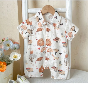 Detail of baby cotton floral romper with cartoon animal prints and polo collar design