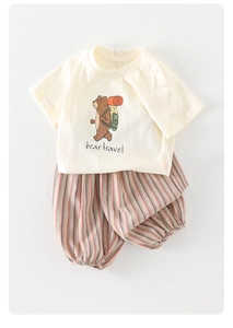 Detail view of cotton beige t-shirt with bear travel print and striped bloomers