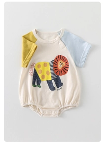 Detail of baby bodysuit with cartoon lion print, contrast sleeves, and snap buttons