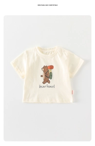 Close-up of a cream cotton toddler t-shirt with a cute bear travel print and buttons